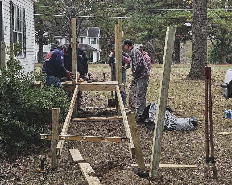 Volunteers building frame